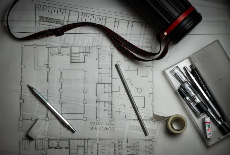 Architectural blueprints with drafting tools