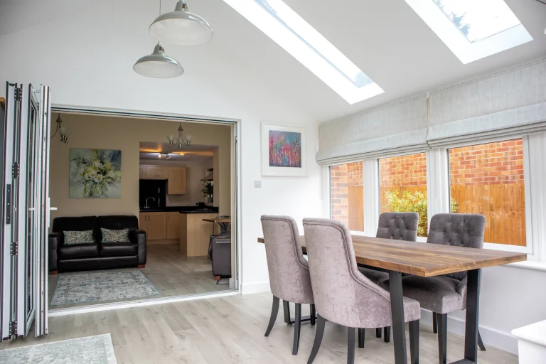 Dining room with rooflights and a view to the kitchen