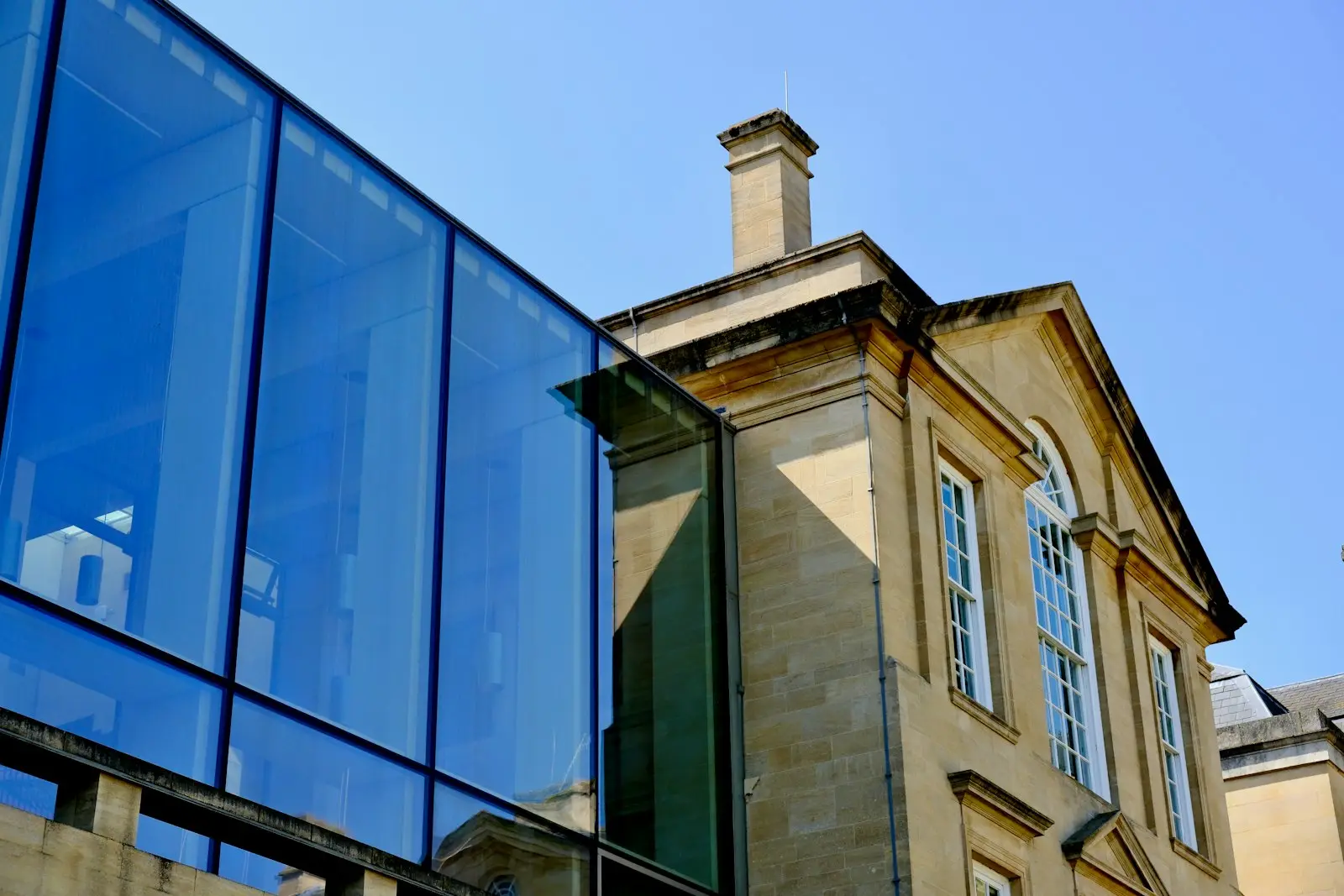Glazed extension added to a stone building