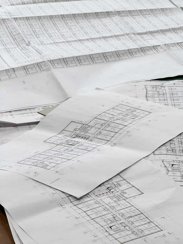 Architectural plans spread out on a surface